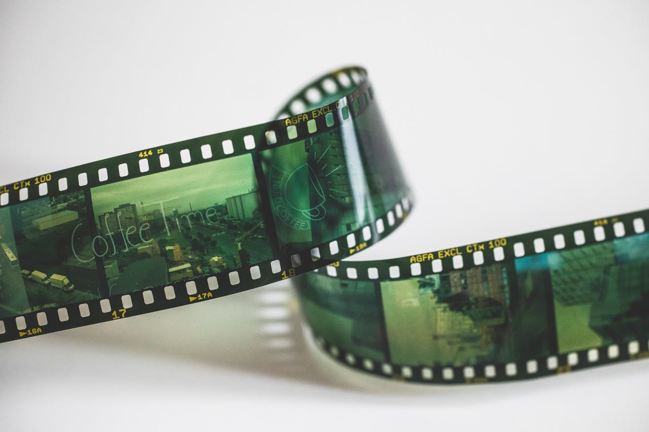 Close-up of a vintage AGFA filmstrip with cinematic exposures, evoking nostalgia.